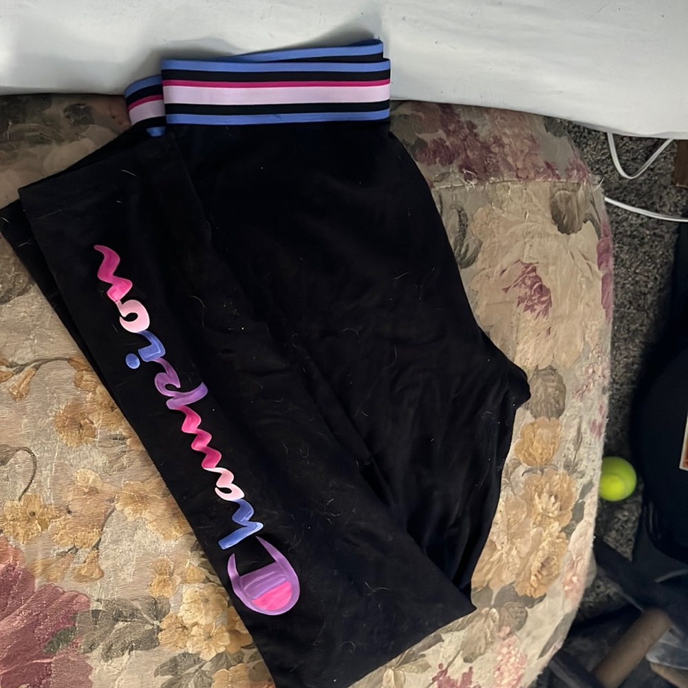 Black leggings with champion on one of the legs super cute